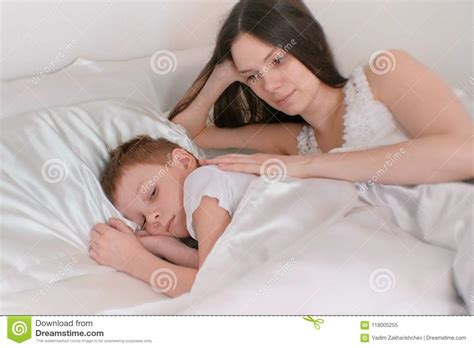 Mom Puts Her Son To Bed Stroking His Back Stock Image Image Of