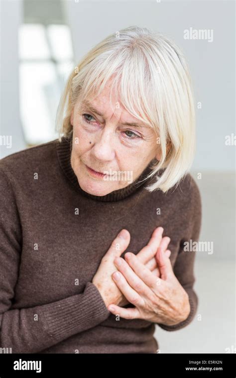 Senior Woman Clutching Her Painful Chest Stock Photo Alamy