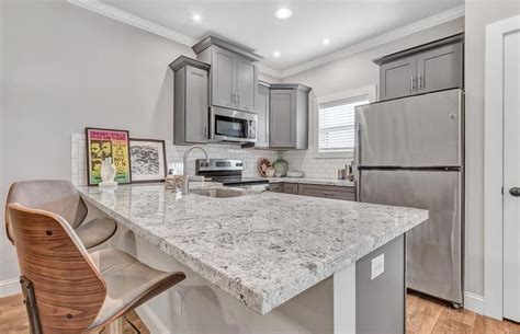 It does have a slight green undertone. Grand Collection - Soft Grey Shaker | Kitchen cabinetry, Kitchen cabinets, Home