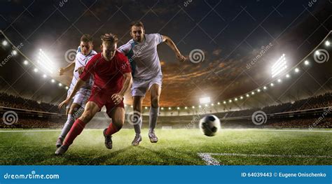 Soccer Players In Action On Sunset Stadium Background Panorama Stock