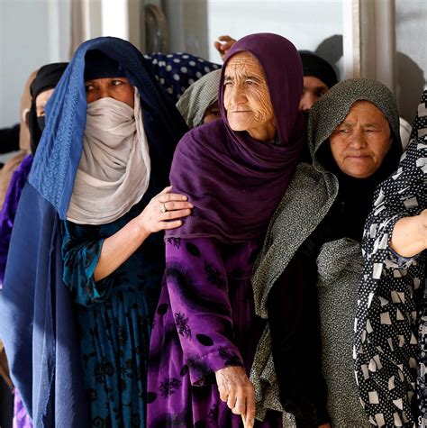 Afghan Women Line Up To Cast Their Votes During A Parliamentary