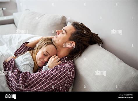 Happy Young Couple Cuddling And Sleeping At Home Stock Photo Alamy