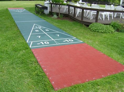A Red And Green Shuffle Board In The Grass