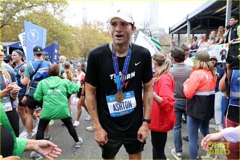 ashton kutcher races to finish line during new york city marathon and raises money for charity
