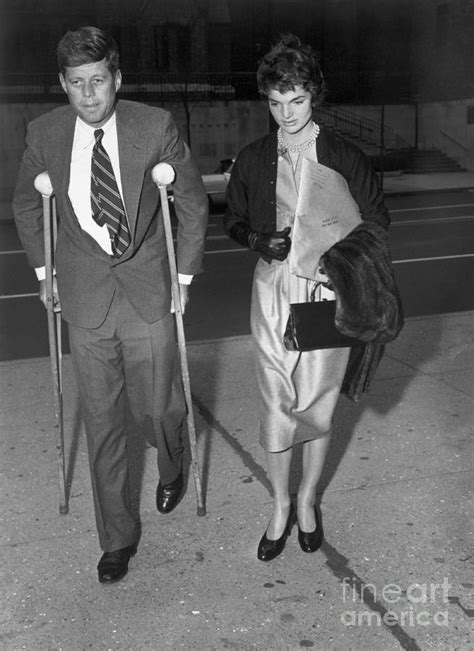 John F Kennedy On Crutches With Wife Photograph By Bettmann Fine Art
