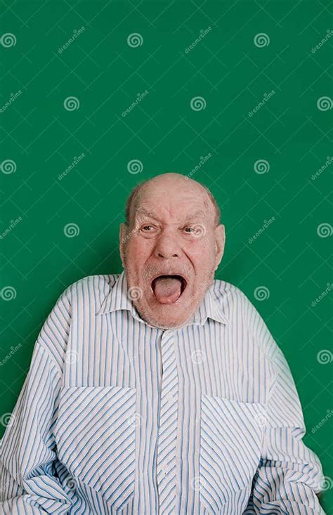 A Large Portrait Of A Crazy Old Man On An Isolated Green Background