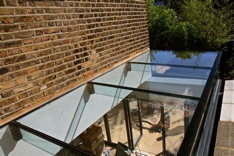 A Glass Roof On Top Of A Brick Building