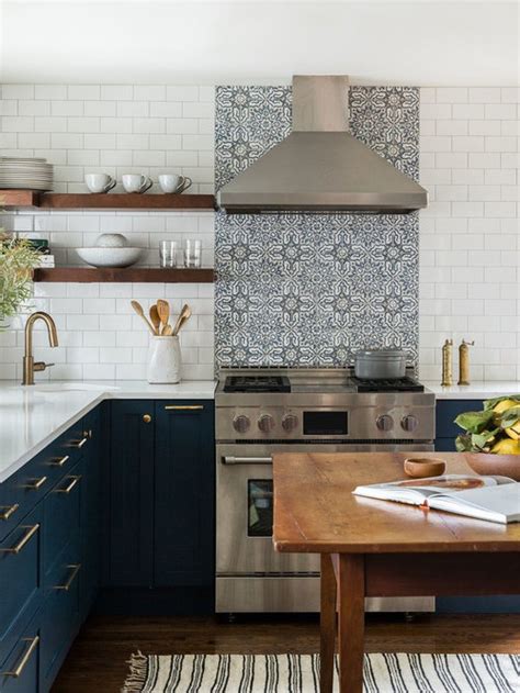 Here, glossy white subway tile blends flawlessly with the white shaker cabinets. Kitchen Backsplash Ideas | Houzz