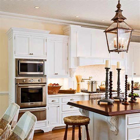 Gray is an excellent pick for the lower cabinets because it brings both warmth and neutrality to any space. Kitchen Designed for Comfort | Traditional Home