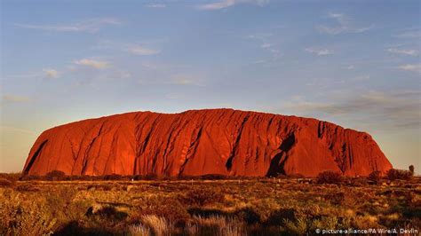 Uluru, also known as ayers rock and officially gazetted as uluru / ayers rock, is a large sandstone rock formation in the southern part of the northern territory in australia. Australia bans tourists from climbing Uluru | News | DW ...