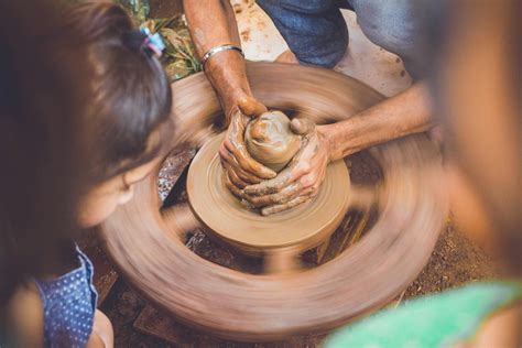 Person Making Clay Pot In Front Of Girl During Daytime · Free Stock Photo