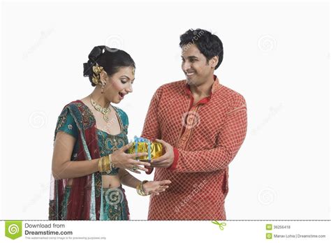 Gifting a wife or partner can be hard, you may need to get even more creative as the years go on to keep things exciting and remind them just how much you love spending time and living life alongside. Man Giving Gift To His Wife On Diwali Stock Photo - Image ...
