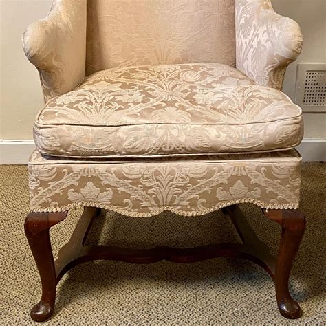 The chair is a paler green than appears in the. A c1920 Queen Anne style armchair with brocade upholstery ...