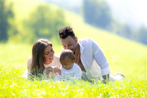 Premium Photo Multiethnic Parents And Mixed Race Baby In Park