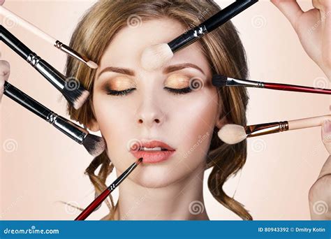 Many Hands Applying Make Up To Glamour Woman Stock Photo Image Of