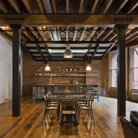 Beautifully renovated basement kitchen with exposed black ceilings, butcher block counters, and grey cabinets. Basement ceiling finishing idea - exposed beams ...