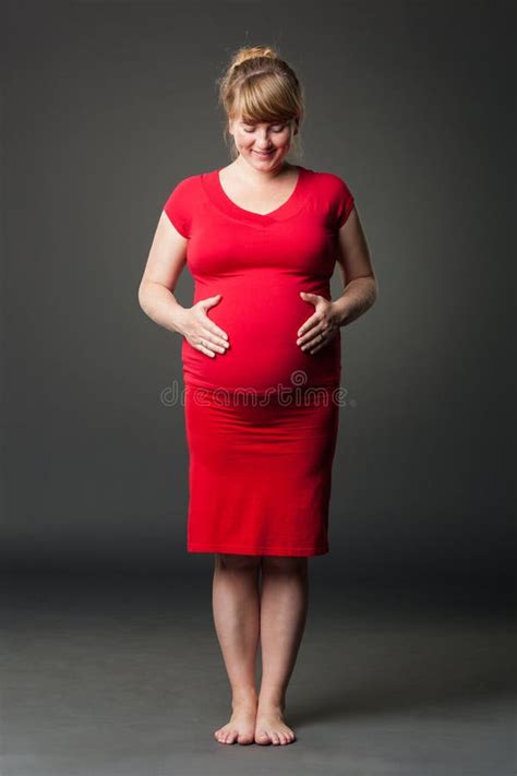 Portrait Of Beautiful Pregnant Woman In Red Dress Stock Photo Image
