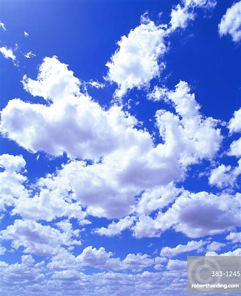 Puffy White Cumulus Clouds In Stock Photo