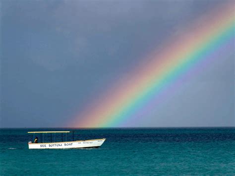 Rainbow Over The Ocean With A Boat In Jamaica Image Free Stock Photo