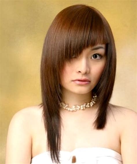 An asymmetrical haircut doesn't mean your hair needs to be short. Long asymmetrical hairstyle for Asian hair
