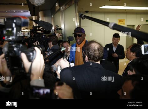 Retired Nba Star Dennis Rodman Back Center Is Interviewed After Arriving At The Beijing
