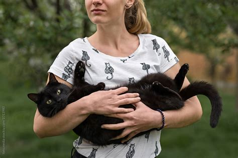 Woman Holding Her Black Cat By Rgandb Images Stocksy United