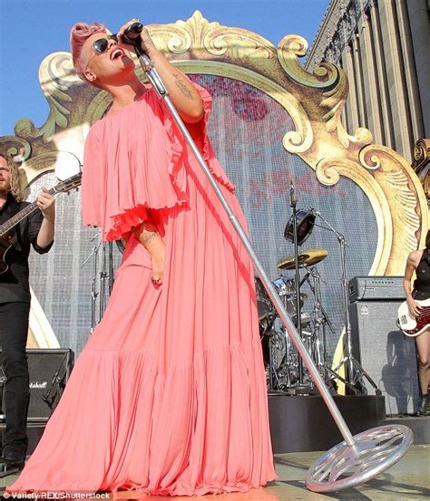 pink dons a pleated gown as she performs just like fire pink singer