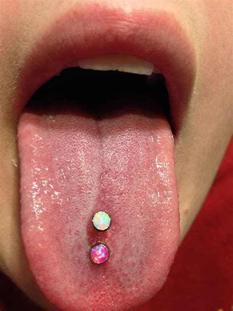 double tongue piercing with the beautiful opals from industrial strength scoop tongue piercing