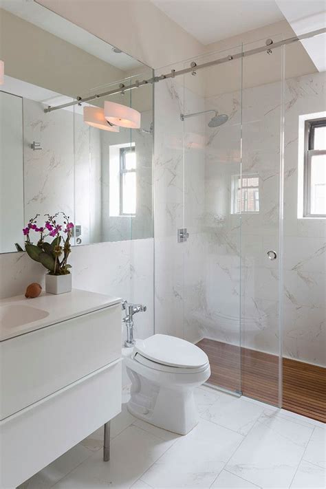 The showers look awesome with the wall shelves. Living with a Small Bathroom … | Shower sliding glass door ...