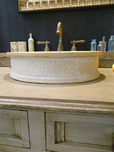 Kitchen sink basket holds sponges, scrubbers, scouring pads, bars of soap, drain stoppers, razors, washcloths, and more! Gold & white vessel sink by Atmosphrye. www.atmosphyre.com ...