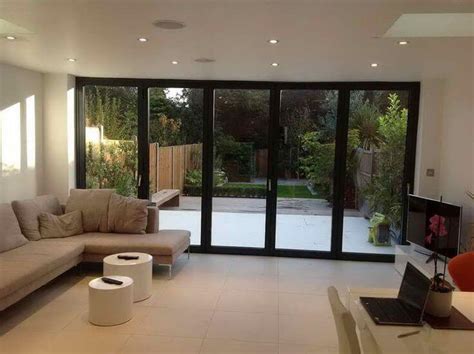 A garage conversion is more than just sealing cracks and painting walls; double-garage-conversion-idea-snug-living-room - Milestone ...