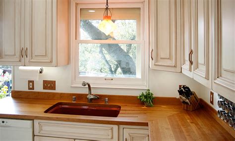 Compare kitchen countertops pros & cons, durability, cost, cleaning, and colors. Cherry Wood Countertop with Sink by Grothouse ...