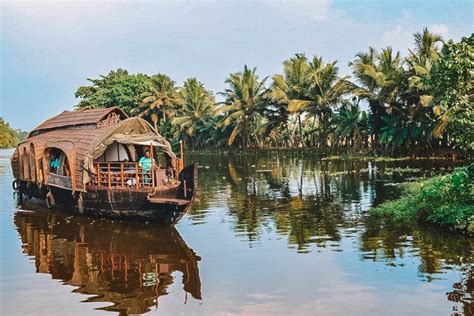 A Traditional Kettuvallom Boat Surrounded By The Palm Trees Of The Kerala Backwaters Kerala