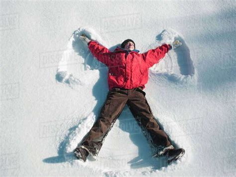 Woman Making Snow Angel Stock Photo Dissolve