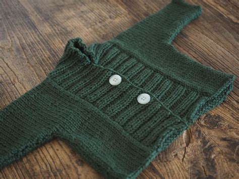 The project is ideal for beginner knitters! a little cardigan finished