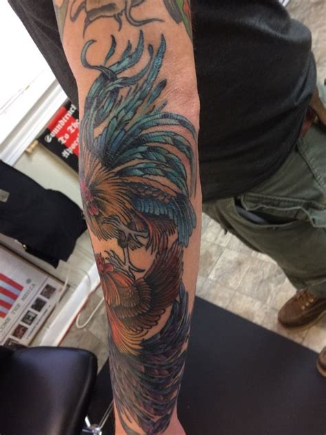 The design itself features two roosters, often with brightly colored feathers and fully extended. robbie:fighting-roosters-chicken-rooster-chicken-fight ...