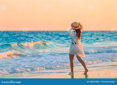 Young Beautiful Woman On Tropical Beach In Sunset Stock Photo Image