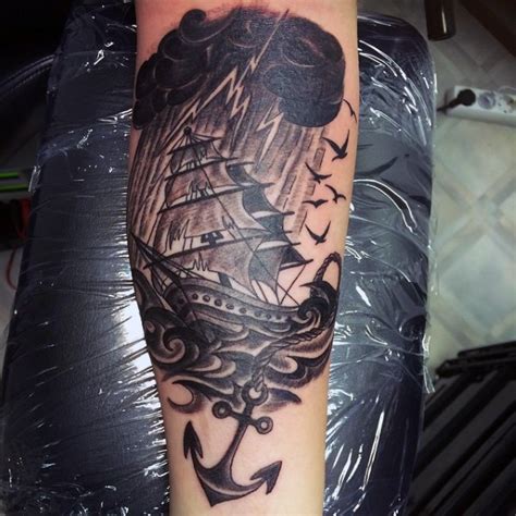 Iris goddess custom tattoo design. Big black and white nautical ship with anchor and lightning tattoo on arm - Tattooimages.biz