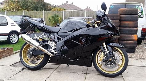 Pvm wheels, gpr dampner, yosh ti/carbon trc full race exhaust, gilles adjustable rearsets, galfer waves, hh pads, ss lines, crg supersport levers, pciii, rk 520 chain, afam sprockets, puig screen, puig hugger, speedo healer, r1 throttle tube. 2004 SUZUKI GSXR 750 BLACK AND GOLD CUSTOM BODYWORK GSXR750