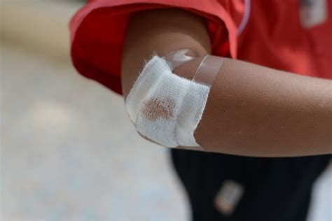 Premium Photo Boy Injured Bloody Wound On The Childs Arm With Bandage