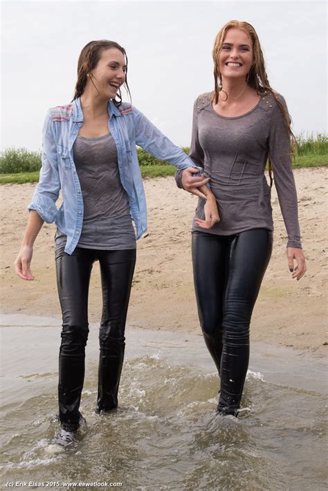 wwf 83295 photoset of 2 girls in a lake in jeans and sneakers sports shoes wetlook world