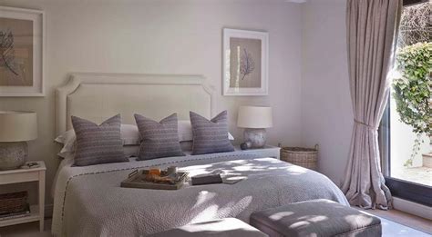 Purple And Gray Bedroom With Stools At Foot Of The Bed Transitional