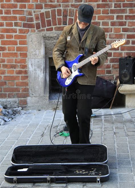 Street Musician Is Playing Guitar Outdoor In Krakow Poland Editorial