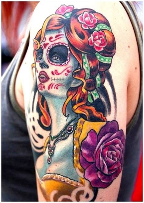 A female sugar skull tattoo with blue flowers inked on the leg. 51 Ultimate Sugar Skull Tattoos | Amazing Tattoo Ideas