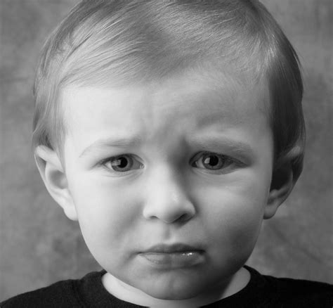 Find images of sad face. Boy with a Sad Face