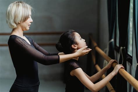 Pupil Doing Exercises With Ballet Teacher In Studio · Free Stock Photo