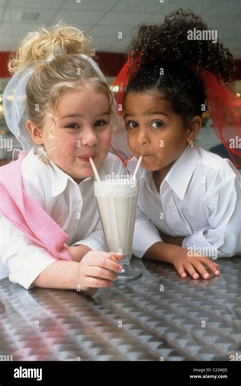 Two Girls Sharing Milkshake Hi Res Stock Photography And Images Alamy