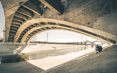 Shadowy Figure Hiding Underneath Bridge Captured By Photographer