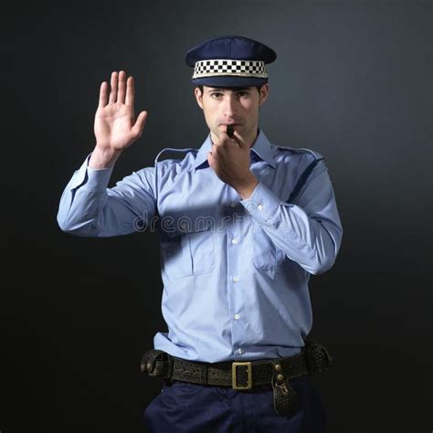 Policeman Gesturing To Stop Police Officer Making The Stop Sign Dark Backgroun Sponsored