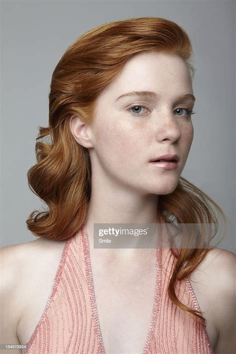 Portrait Of Redhead Girl In Salmon Dress Photo Getty Images